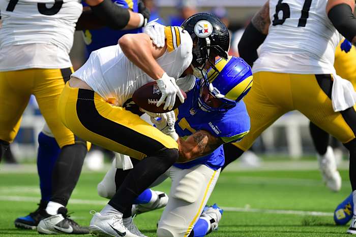 Oct 22, 2023; Inglewood, California, USA; Pittsburgh Steelers quarterback Kenny Pickett (8) is brought down by Los Angeles Rams linebacker Michael Hoecht (97) during the first half at SoFi Stadium. Mandatory Credit: Gary A. Vasquez-USA TODAY Sports